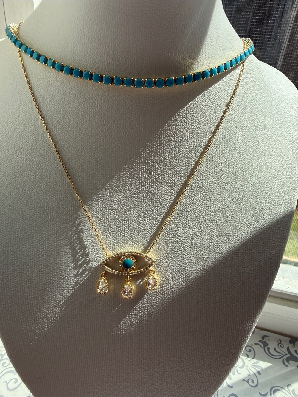 Two necklaces- evil eye and turquoise tennis!